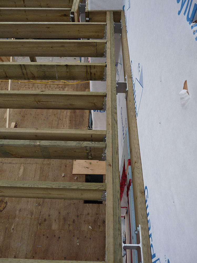Deck fastening to building using Maine Deck Bracket